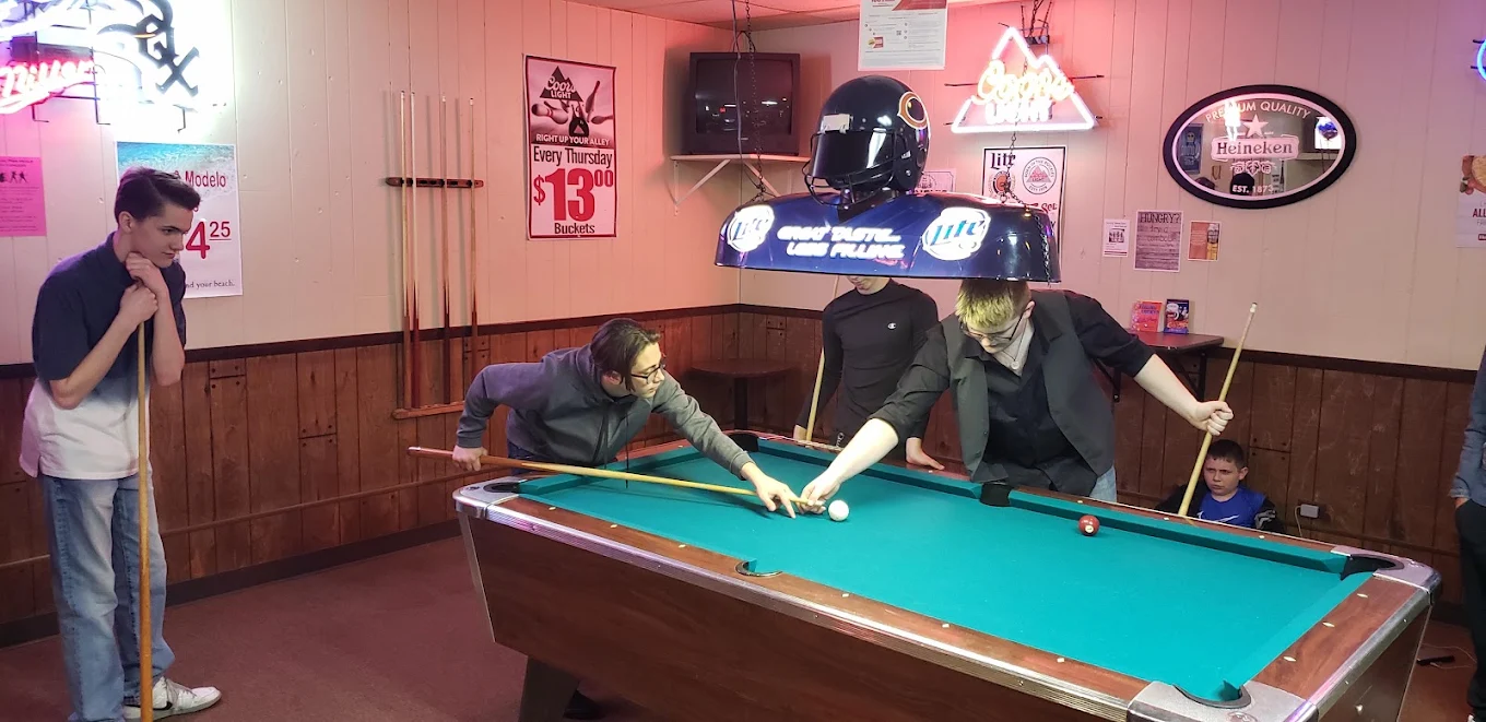 Guests playing pool at the pool table